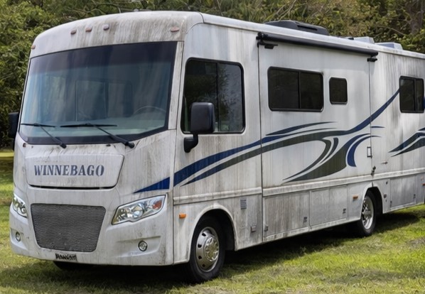 Before — 2024 Ram 1500 covered in road grime